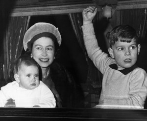 Queen Elizabeth II, with sons, Prince Edward, 9 months, and Prince Andrew, leave Liverpool street railway station in London on Dec. 30, 1964 bound for Sandringham, Norfolk, for a visit. Sandringham is the usual Christmas holiday retreat of the British Royal family. Prince Philip and two older children are in Switzerland for a skiing vacation. (AP Photo/Laurence Harris)