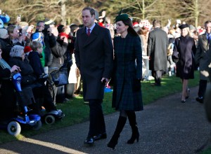 Britain's Prince William, left, accompanied by his wife Kate, Duchess of Cambridge, arrive to attend a Christmas Day Service with other members of the royal family at St. Mary's church on the grounds of Sandringham Estate, the Queen's royal estate, in Norfolk, England, Wednesday, Dec. 25, 2013. (AP Photo/Lefteris Pitarakis)