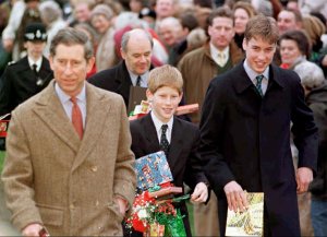 Princes William, far right, and Prince Harry, centre,  clutch gifts from  wellwishers as they leave Sandringham Church with their father, Prince Charles, after attending morning service Thursday Dec. 25, 1997.  Both teenage Princes - spending their first Christmas without their mother -  managed a smile and thanked people for their good wishes. (AP Photo/John Stillwell)