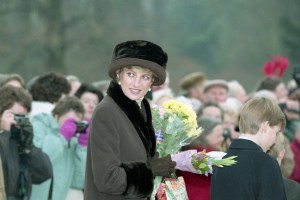 Princess Diana, the Princess of Wales, with flowers and Christmas presents she received from the public outside the Sandringham Church, England, after the Christmas Day service on Dec. 25, 1994. The Princess attended the service with the rest of the British Royal family and several hundred people lined the road outside the Church to bid the Royal family happy Christmas. (AP Photo/Max Nash)