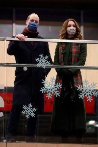 Duke and Duchess of Cambridge royal train tour. The Duke and Duchess of Cambridge look on from the balcony at London Euston Station ahead of boarding the royal train as they leave London for a tour across the UK. Picture date: Sunday December 6, 2020. During the tour William and Kate will visit communities, outstanding individuals and key workers to thank them for their efforts during the coronavirus pandemic. See PA story ROYAL Train. Photo credit should read: Chris Jackson/PA Wire URN:56981237 (Press Association via AP Images)