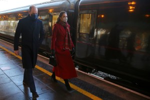 Duke and Duchess of Cambridge royal train tour. The Duke and Duchess of Cambridge walk along the platform as they arrive at Cardiff Central train station on the final day of a three-day tour across the country. Picture date: Tuesday December 8, 2020. See PA story ROYAL Train. Photo credit should read: Geoff Caddick/PA Wire URN:57000560 (Press Association via AP Images)