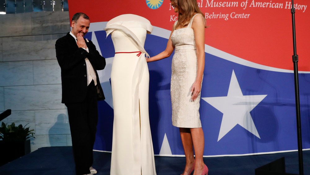 First lady Melania Trump, right, donates her inaugural gown, designed by Herve Pierre, right, to the First Ladies' Collection at the Smithsonian's National Museum of American History, during a ceremony in Washington, Friday, Oct. 20, 2017. (AP Photo/Pablo Martinez Monsivais)