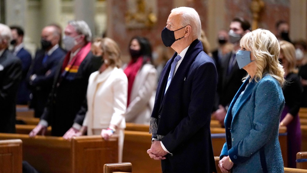 President-elect Joe Biden is joined his wife Jill Biden as they celebrate Mass at the Cathedral of St. Matthew the Apostle during Inauguration Day ceremonies Wednesday, Jan. 20, 2021, in Washington. (AP Photo/Evan Vucci)