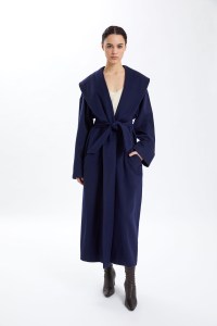 Calvin Klein Collection wool wrap coat, fall 1972, over a Resort 1994 dress.