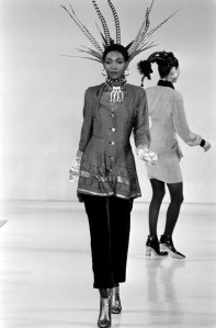 Model Roshumba Williams walks the runway in printed tunic and pants designed by Byron Lars for fall 1994.