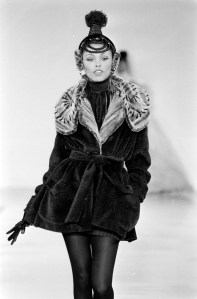 Model Louise Vyent walks the runway in faux fur belted coat designed by Byron Lars for fall 1994.