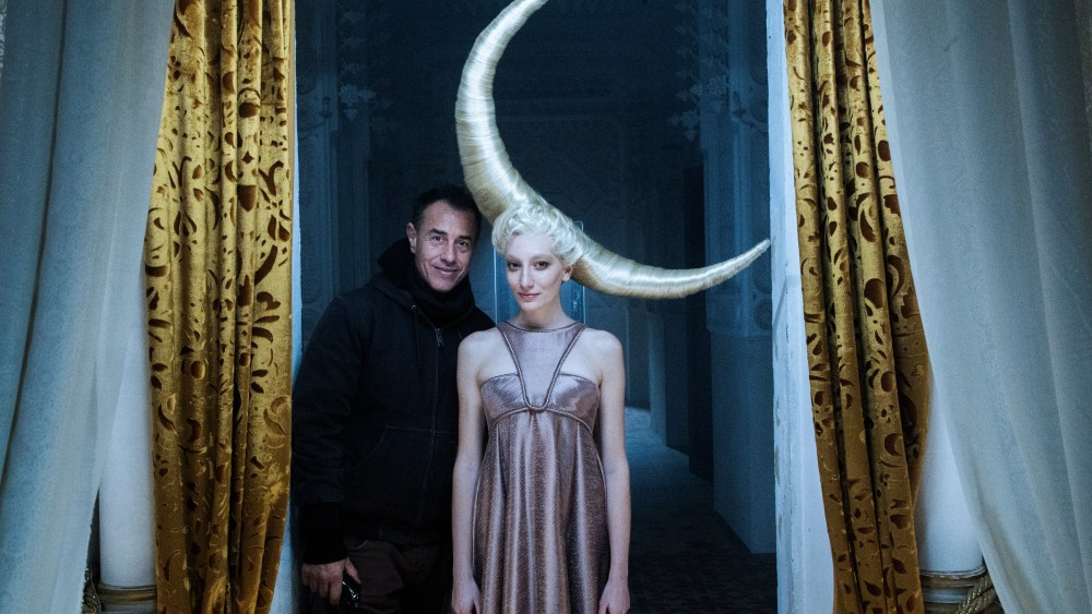 Matteo Garrone with a model on the set of his short film for Dior.