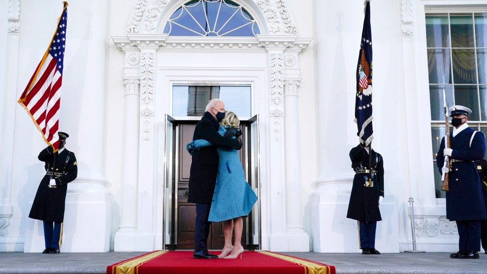 President Joe Biden hugs first lady Jill Biden as they arrive at the North Portico of the White House, Wednesday, Jan. 20, 2021, in Washington. (AP Photo/Evan Vucci)