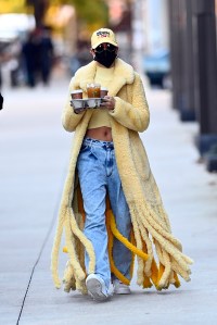 Hailey Bieber shows her new tattoos while out to pick up her ice coffe in New York City wearing a yellow¬†Bottega Veneta coat.Pictured: Hailey BieberRef: SPL5193284 171020 NON-EXCLUSIVEPicture by: Elder Ordonez / SplashNews.comSplash News and PicturesUSA: +1 310-525-5808London: +44 (0)20 8126 1009Berlin: +49 175 3764 166photodesk@splashnews.comWorld Rights, No Poland Rights, No Portugal Rights, No Russia Rights