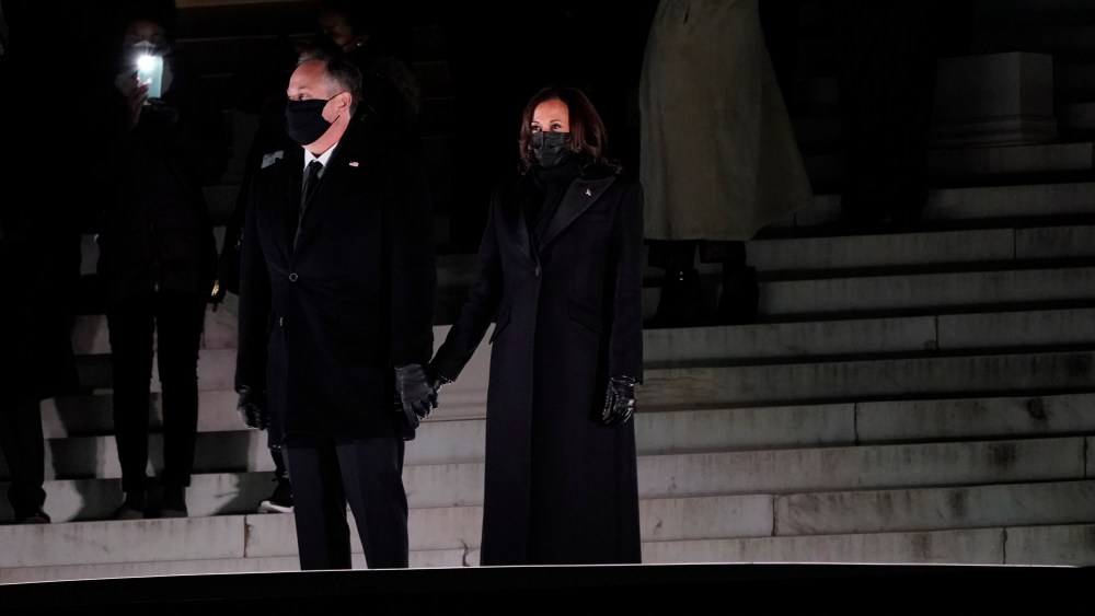 Vice President Kamala Harris holds hands with her husband Doug Emhoff before watching fireworks at the Lincoln Memorial, Wednesday, Jan. 20, 2021, in Washington. (AP Photo/Jacquelyn Martin)