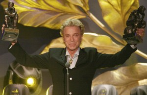 German magician Siegfried Fischbacher of the duo " Siegfried & Roy"  holds their trophies after receiving the  World Entertainment Award from former Soviet President Mikhail Gorbachev, unseen, , during the " World Award 2003 " ceremony in Hamburg, northern Germany, on Wednesday, Oct.22, 2003. Fischbacher's partner Roy Horn remains in a serious condition after a tiger attack this month.  (AP Photo/Fabian Bimmer)