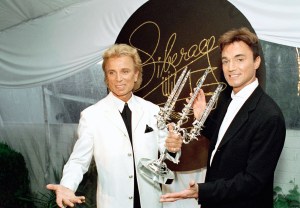 FILE - Illusionists Siegfried Fischbacher, left, and Roy Horn pose after receiving the second annual Liberace Legend Award at a gala benefit in Las Vegas on May 17, 1995. German news agency dpa is reporting that Fischbacher, the surviving member of duo Siegfried & Roy has died in Las Vegas at age 81. The news agency said Thursday that Fischbacher’s sister, a nun who lives in Munich, confirmed his death of cancer. Fischbacher’s long-time show business partner, Roy Horn, died in May of complications from COVID-19 at a Las Vegas hospital.  (AP Photo/Lennox McLendon, File)
