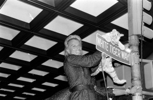Entertainer Siegfried Fischbacher holds a baby tiger during a dedication ceremony for "White Tiger Way" at New York's Radio City Music Hall on September 18, 1989.