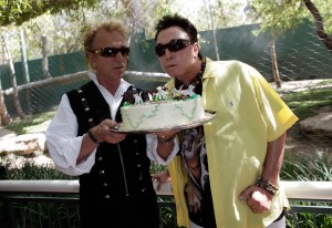 Siegfried Fischbacher, left, and Roy Horn blow out a candle as they celebrate tiger cubs' first birthday at Secret Garden & Dolphin Habitat at the Mirage hotel and casino in Las Vegas, Tuesday, May 12, 2009. (AP Photo/Jae C. Hong)