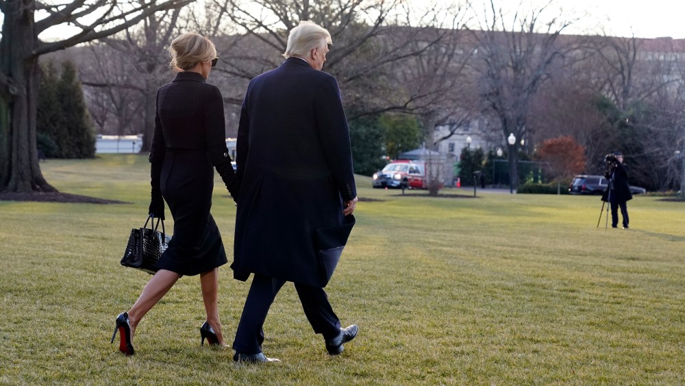 President Donald Trump and first lady Melania Trump walk to board Marine One on the South Lawn of the White House, Wednesday, Jan. 20, 2021, in Washington. Trump is en route to his Mar-a-Lago Florida Resort. (AP Photo/Alex Brandon)