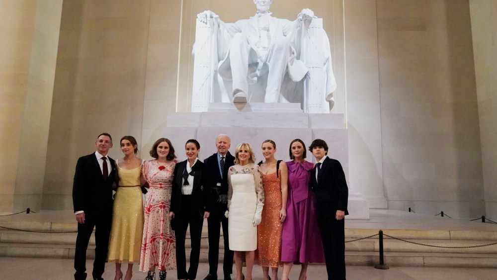 President Joe Biden and first lady Jill Biden pose for a photo with family members at the Celebrating America concert at the Lincoln Memorial in Washington, Wednesday, Jan. 20, 2021, after his inauguration.. (Joshua Roberts/Pool photo via AP)