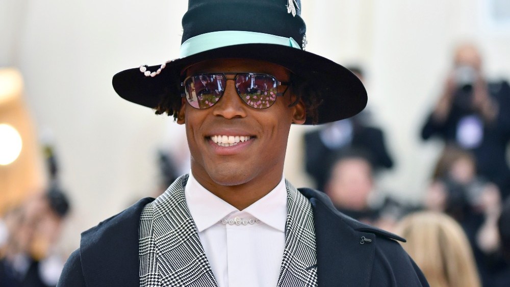 New England Patriots star Cam Newton, having spent “maybe millions” on clothes he wore once, plans to patronize thrift and vintage stores.