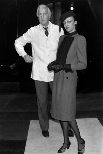 Designer Hubert de Givenchy and model Sandi Bass wearing a look from the fall 1980 ready to wear collection.