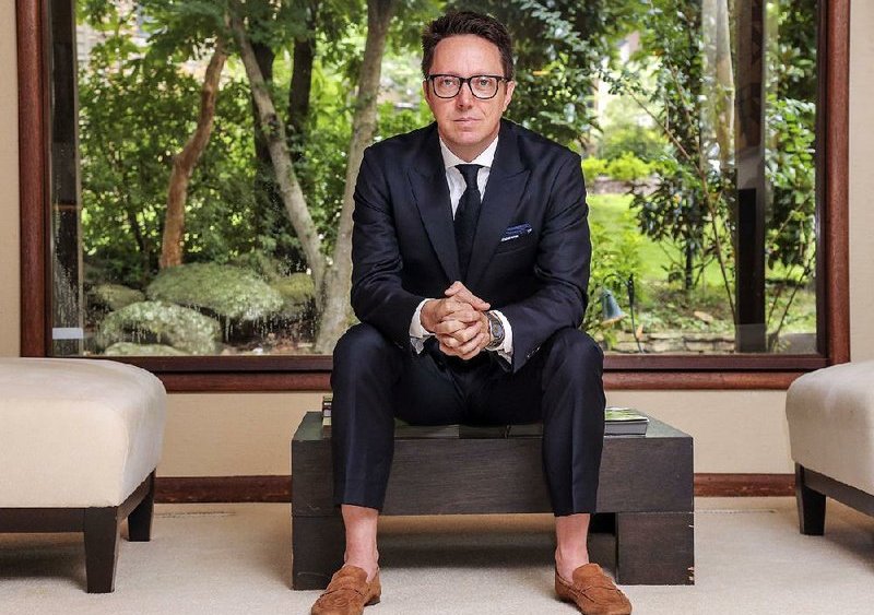 Jamie Davidson seated in suit