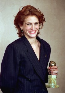 Actress Julia Roberts poses with her Globe award backstage at the 48th Annual Golden Globe Awards in Beverly Hills, Calif., on Jan. 20, 1991.  Roberts won for Best Actress in a Comedy for the movie "Pretty Woman."  (AP Photo/Douglas C. Pizac)