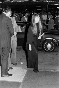 Jane Fonda (C) attends a screening at the Westwood Village Theater in Westwood, California, on October 1, 1975.