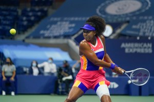 Naomi Osaka, of Japan, returns a shot to Jennifer Brady, of the United States, during a semifinal match of the US Open tennis championships, Thursday, Sept. 10, 2020, in New York. (AP Photo/Seth Wenig)