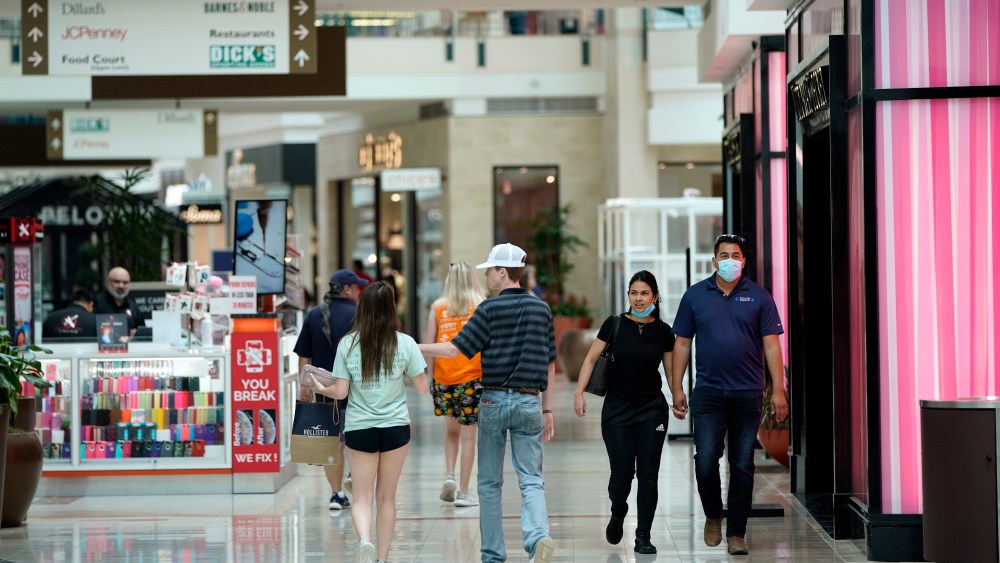 Some shoppers wear masks as they walk through The Woodlands Mall Tuesday, May 5, 2020, in The Woodlands, Texas. The mall reopened with increased health and safety measures in place.Texas' stay-at-home orders due to the COVID-19 pandemic have expired and Texas Gov. Greg Abbott has eased restrictions on many businesses that have now opened. (AP Photo/David J. Phillip)