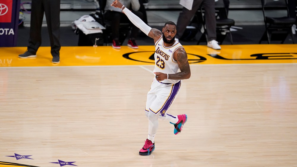 Los Angeles Lakers forward LeBron James (23) signals during the first half of an NBA basketball game against the Atlanta Hawks Saturday, March 20, 2021, in Los Angeles. (AP Photo/Marcio Jose Sanchez)