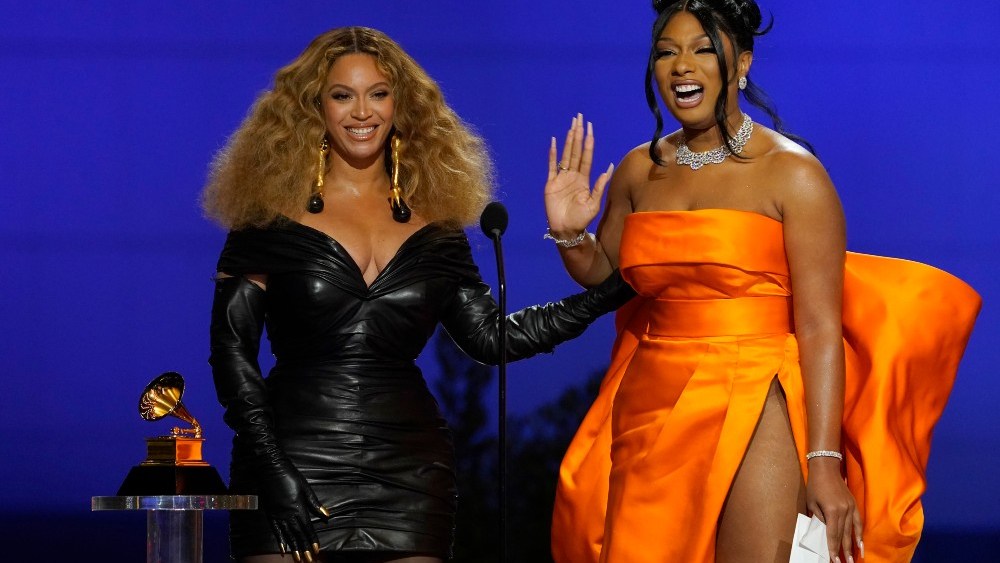 Beyonce, left, and Megan Thee Stallion accept the award for best rap song for "Savage" at the 63rd annual Grammy Awards