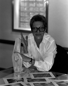 Elsa Peretti holding her designs