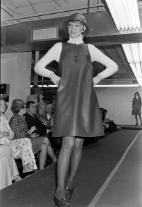 A model walks the runway in a leather A-line dress designed by Anne Klein for fall 1973.