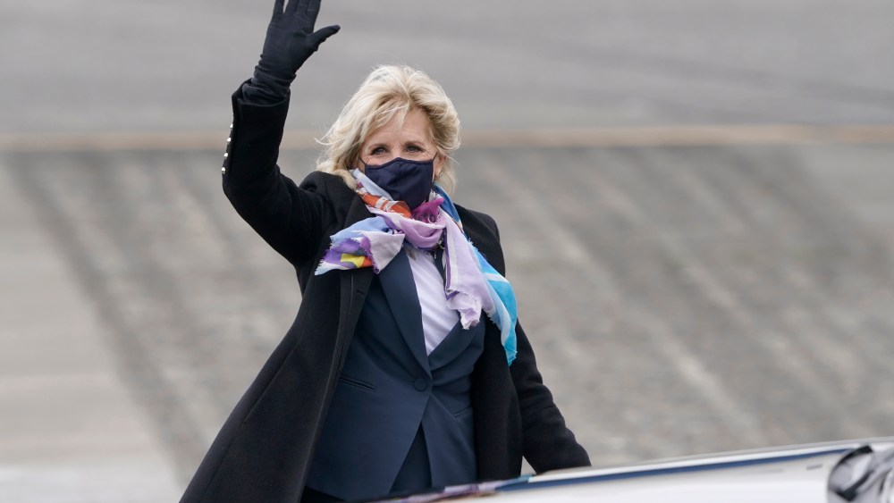 First lady Jill Biden waves after she arrived at Joint Base Lewis-McChord, Monday, March 8, 2021, in Washington state. Biden is scheduled to tour a portion of the base and visit with military families on Tuesday. (AP Photo/Ted S. Warren)