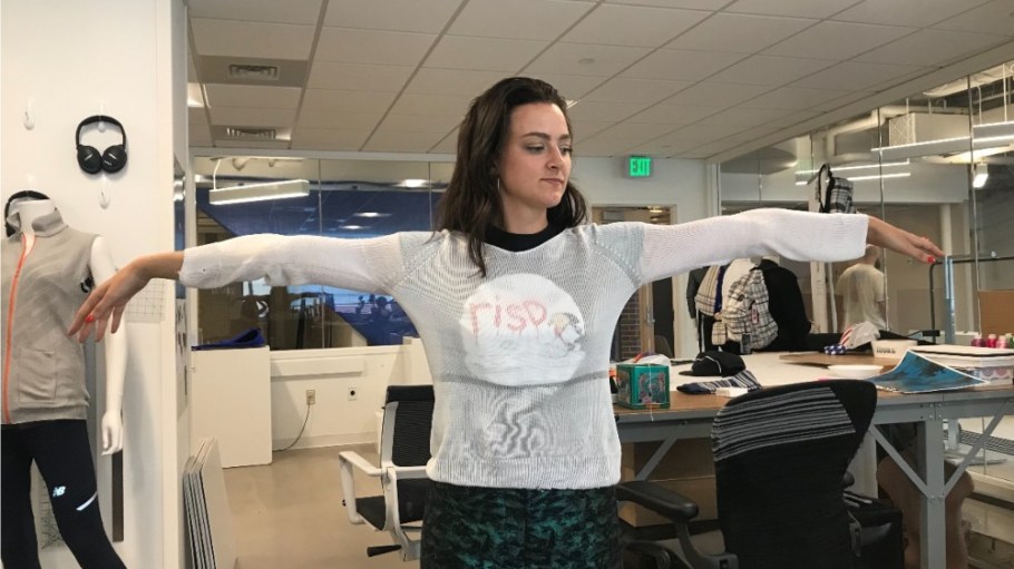 Emily Holtzman knitted and modeled a sweater made with the M.I.T. team's PE fabric.