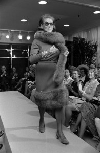 Fashion designer Pauline Trigere wearing a fur trimmed dress at her Spring/Summer Ready to Wear 1972 show at Bergdorf-Goodman in New York.