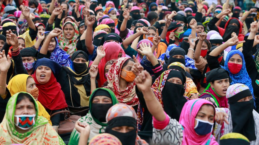 Bangladeshi garment workers block a road as they gather in a protest demanding their unpaid wages during nationwide lockdown to curb the spread of coronavirus in Dhaka, Bangladesh
