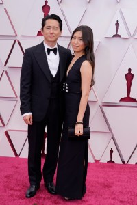 Steven Yeun (in Gucci) and Joana Pak