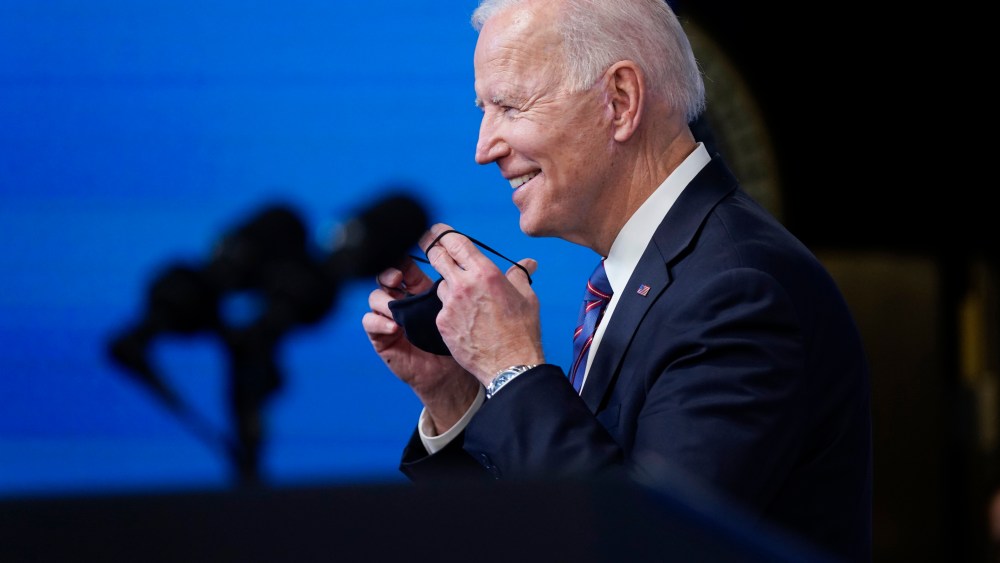 President Joe Biden puts on his face mask after speaking during an event to mark Equal Pay Day in the South Court Auditorium in the Eisenhower Executive Office Building on the White House Campus Wednesday, March 24, 2021, in Washington. (AP Photo/Evan Vucci)