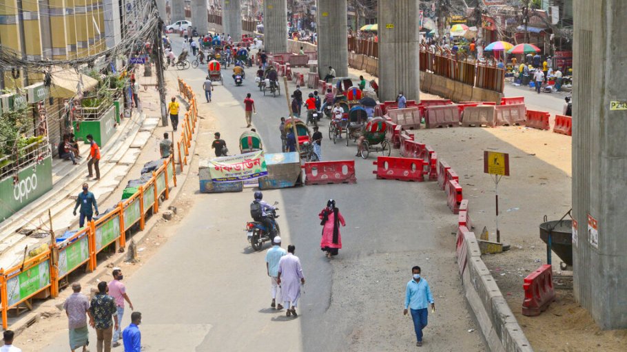 Amid Bangladesh's lockdown, many garment workers in Dhaka have to walk long distances or pay several times their usual fares to get to work.