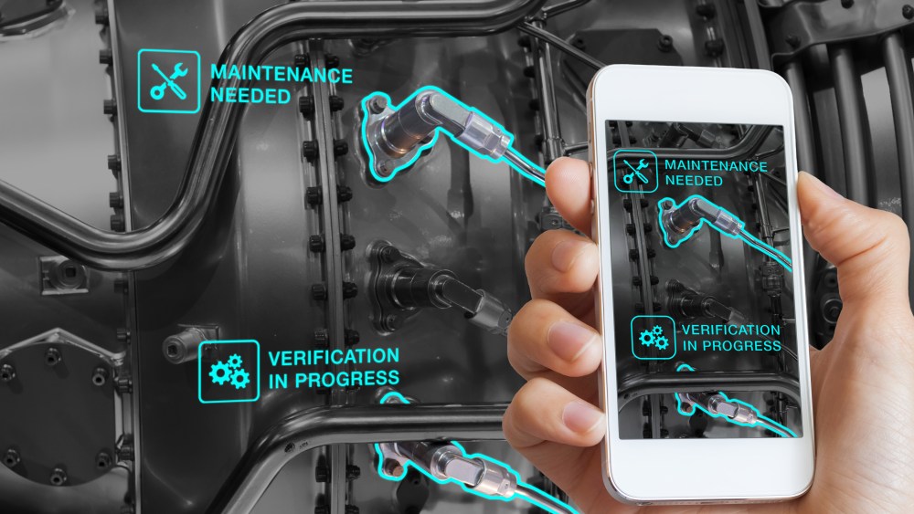 Augmented Reality technology maintenance and service of mechanical parts, technician using smartphone with AR interface on screen in smart industry, automated monitoring process