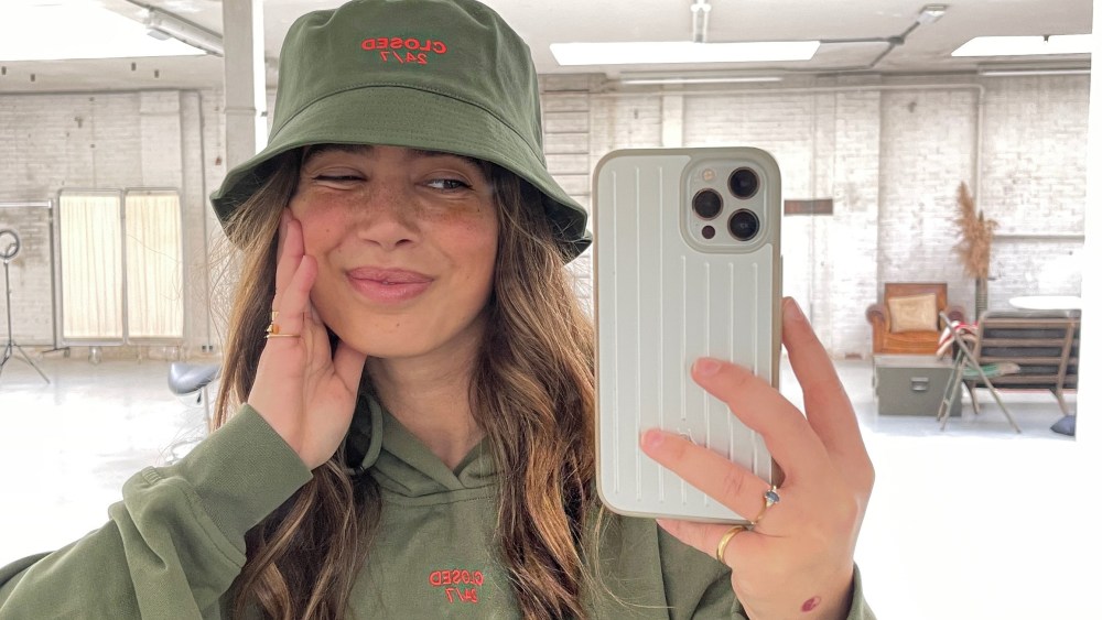 Bruna Bear sporting a hoodie and bucket hat from the Closed 24/7 unisex loungewear capsule collection.