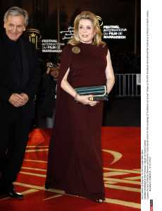 Actress Catherine Deneuve and Director Costa Gavras arrive for the screening of "Un Balcon sur la mer" shown at the10th Marrakech International Film Festival as a tribute to French cinema. Marrakech, MOROCCO - 4/12/2010./Credit:NIKO/SIPA/1012052045