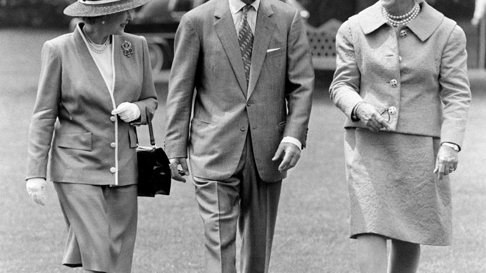 Queen Elizabeth II of England, Prince Philip, Duke of Edinburgh, and Barbara Bush attend a ceremony welcoming the queen to the White House in Washington, D.C., on May 14, 1991.