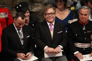 British musician Elton John, centre, and partner David Furnish, left, attend the wedding service for Britain's Prince William and Kate Middleton at Westminster Abbey, London, Friday April 29, 2011. (AP Photo/Adrian Dennis, Pool)