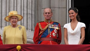 Queen Elizabeth II, the Duke of Edinburgh and Pippa Middleton, appear on the balcony of Buckingham Palace, London, following the wedding of Prince William and Kate Middleton at Westminster Abbey, Friday, April 29.  (AP Photo/John Stillwell, Pool