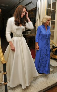Kate, the Duchess of Cambridge, left, leaves Clarence House, London, with Camilla, the Duchess of Cornwall to travel to Buckingham Palace for the evening celebrations following her wedding to Britain's Prince William, Friday April 29, 2011.  With a smile that lit up TV screens around the world, Kate Middleton married Prince William in a union that promised to revitalize the British monarchy. A million people roared their approval as the royal couple then paraded through London in an open carriage. (AP  Photo/John Stillwell, Pool)