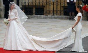 Kate Middleton, left, and accompanied by maid of honour Pippa Middleton  as they arrive at Westminster Abbey at the Royal Wedding in London Friday, April 29, 2011. (AP Photo/Alastair Grant)