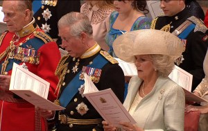 In this image taken from video, From left, Britain's Prince Philip, Britain's Prince Charles, and Camilla, Duchess of Cornwall, sing during the ceremony at Westminster Abbey for the Royal Wedding in London on Friday, April, 29, 2011. (AP Photo/APTN) EDITORIAL USE ONLY NO ARCHIVE PHOTO TO BE USED SOLELY TO ILLUSTRATE NEWS REPORTING OR COMMENTARY ON THE FACTS OR EVENTS DEPICTED IN THIS IMAGE