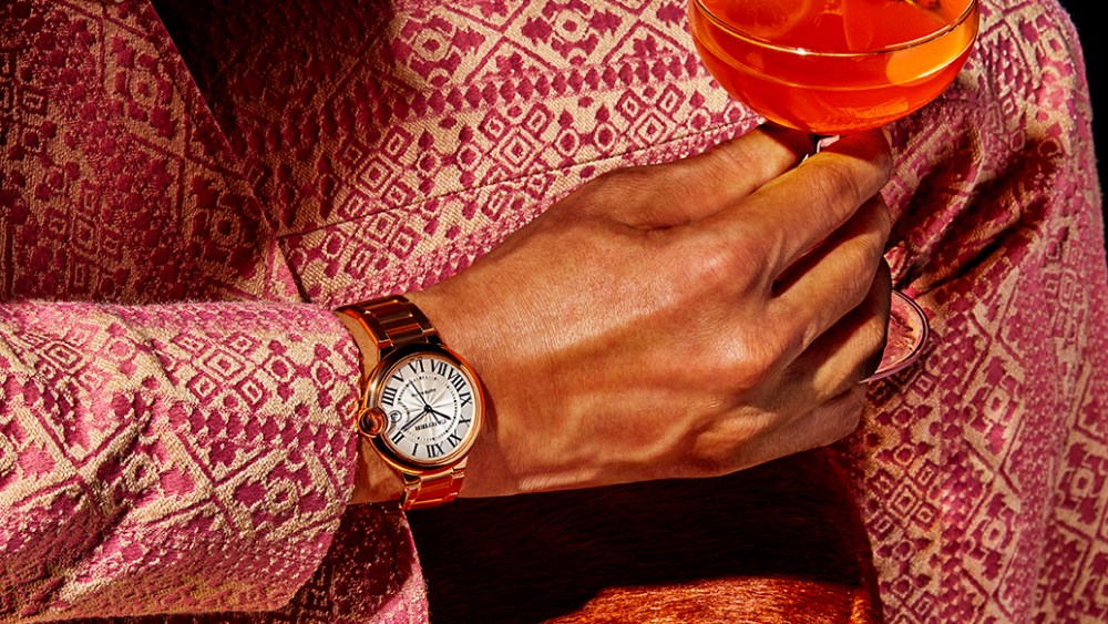 Ballon Bleu de Cartier's watch, 18-karat rose gold, 40 mm. Cartier Love 18-karat rose gold bracelet. Gucci wool suit. Firetip drink
