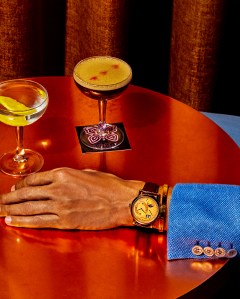 A. Lange & ShneÕs Lange 1 Perpetual Calendar, white gold case with solid gold pink dial watch.Brioni silk jacket; Cartier Love 18-karat yellow gold bracelet. Buckeye drink.